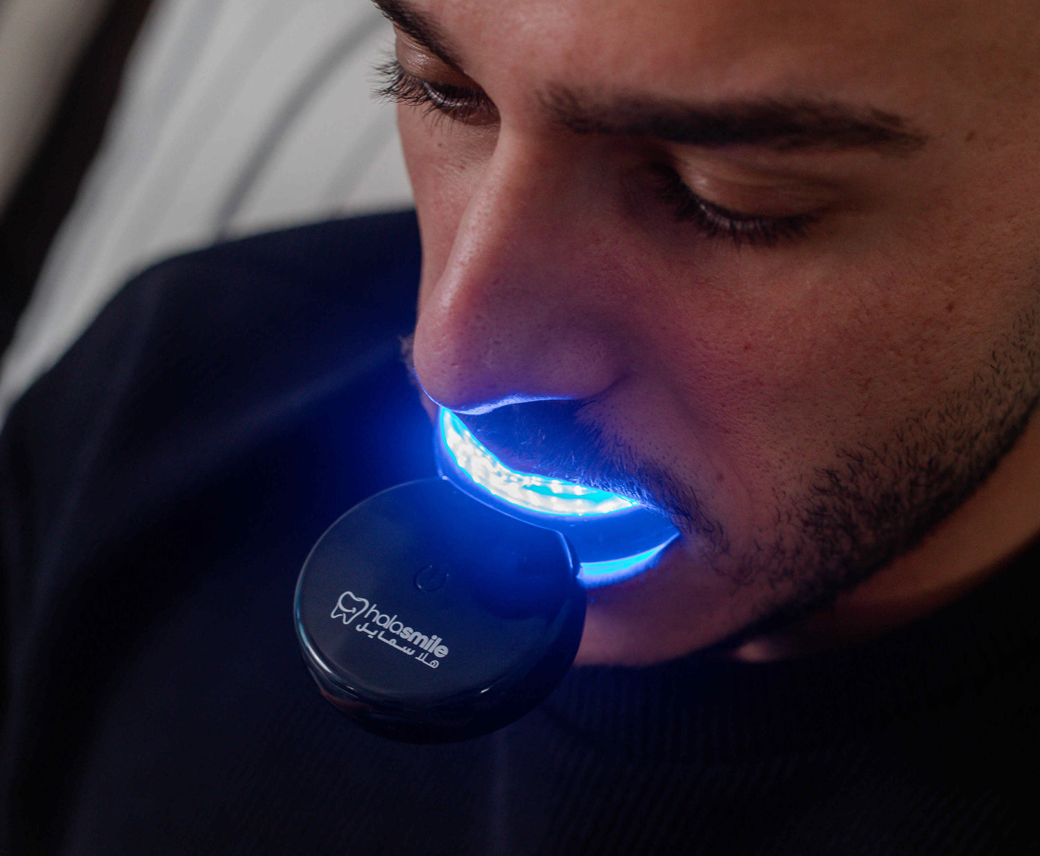 closeup image of teeth whitening device displaying the brightness of lights