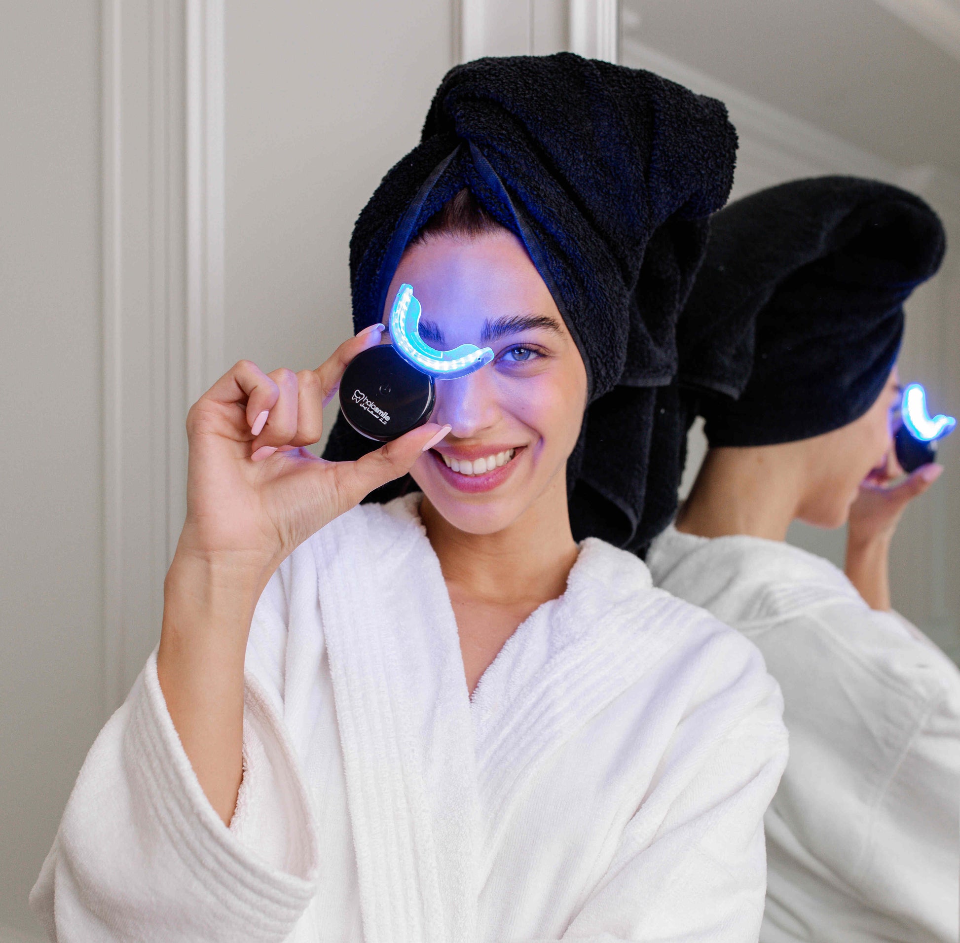 image of girl done with her teeth whitening treatment post shower